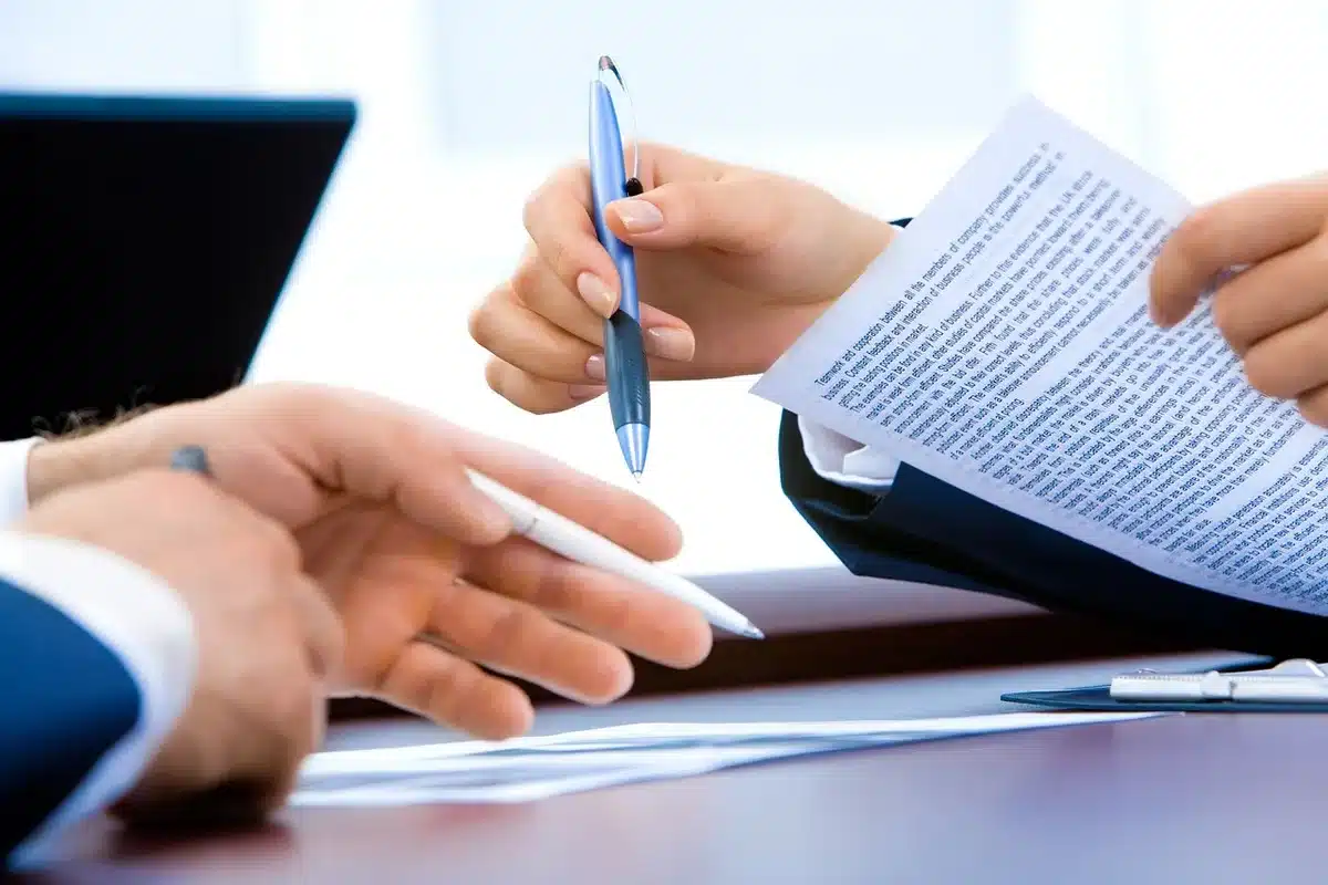 Close-up of compensation report and pen on office desk