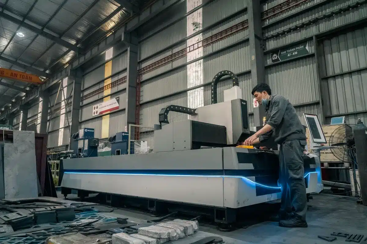 Unbranded EV bodies and robotic arms on a factory floor, representing U.S. auto production