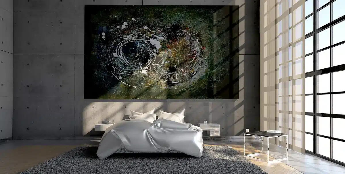 Person watching romantic comedy on a bedroom screen, surrounded by posters
