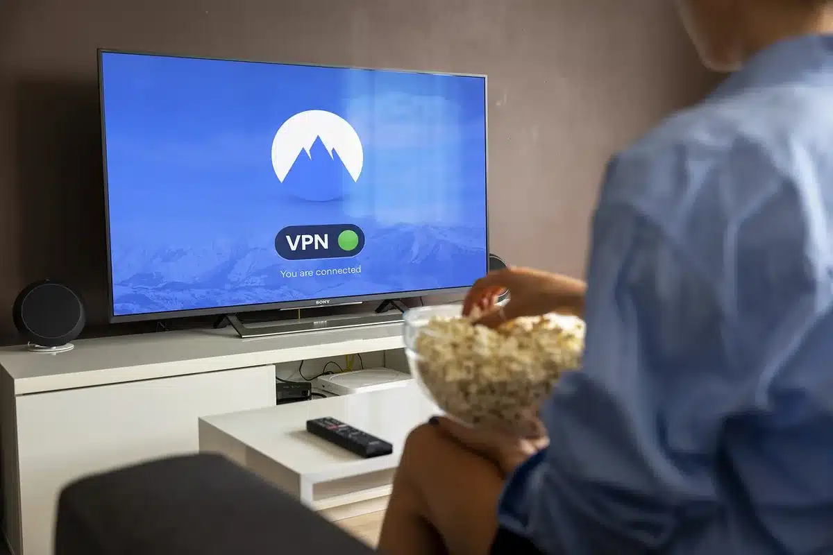 Person holding a phone streaming a football game on Prime Video