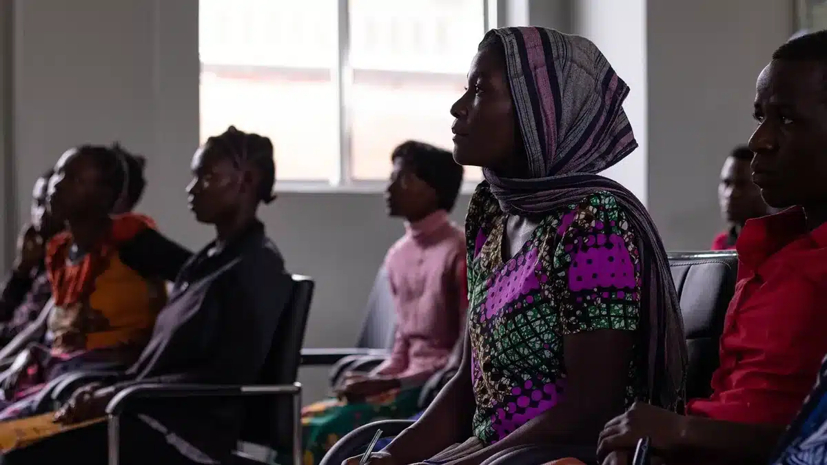 Audience watching a TV series trailer in a screening room