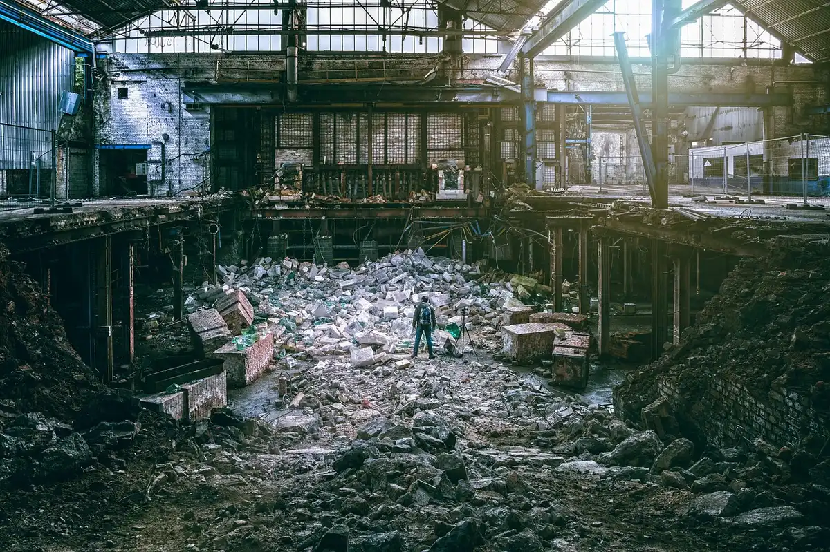 Stacked crates and industrial plant illustrating large-scale produce operations