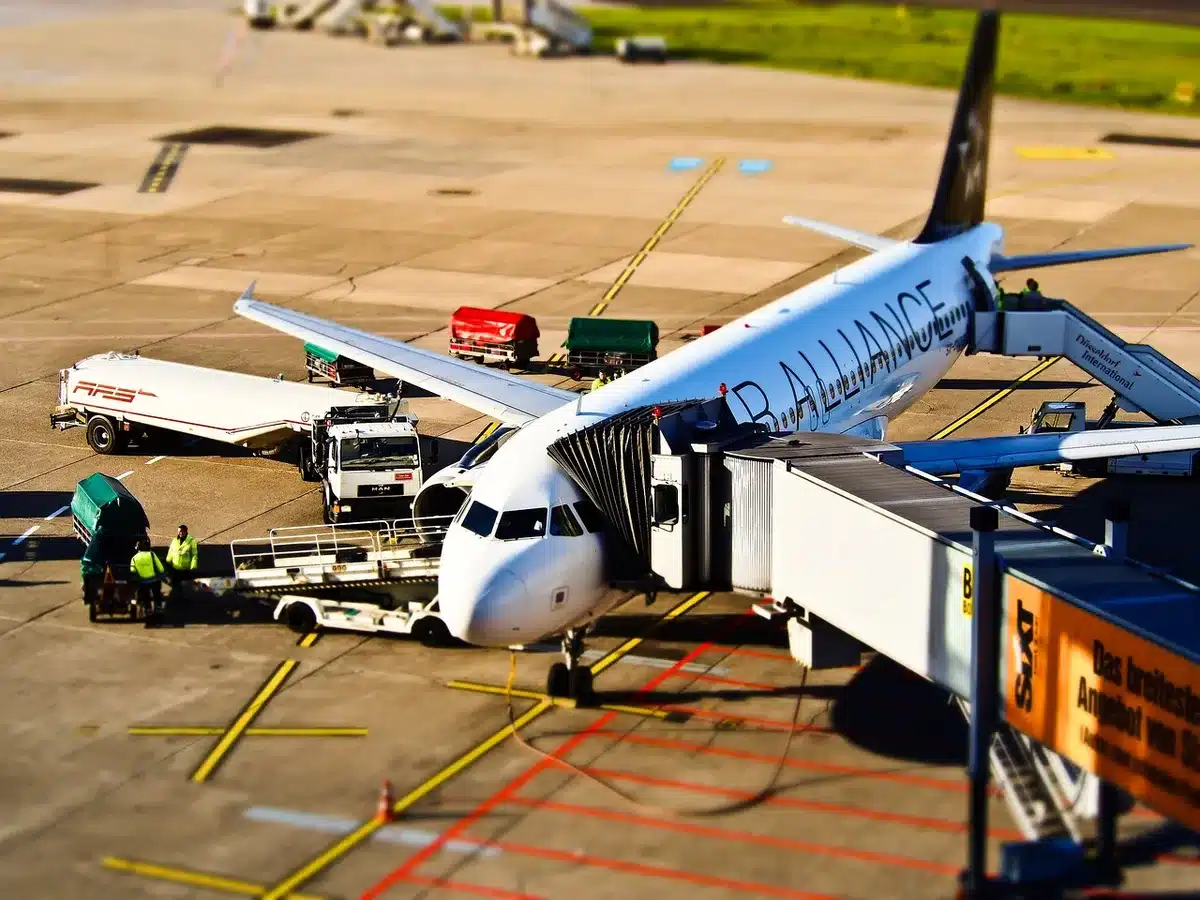 Passengers boarding premium and economy cabins with visible seat rows