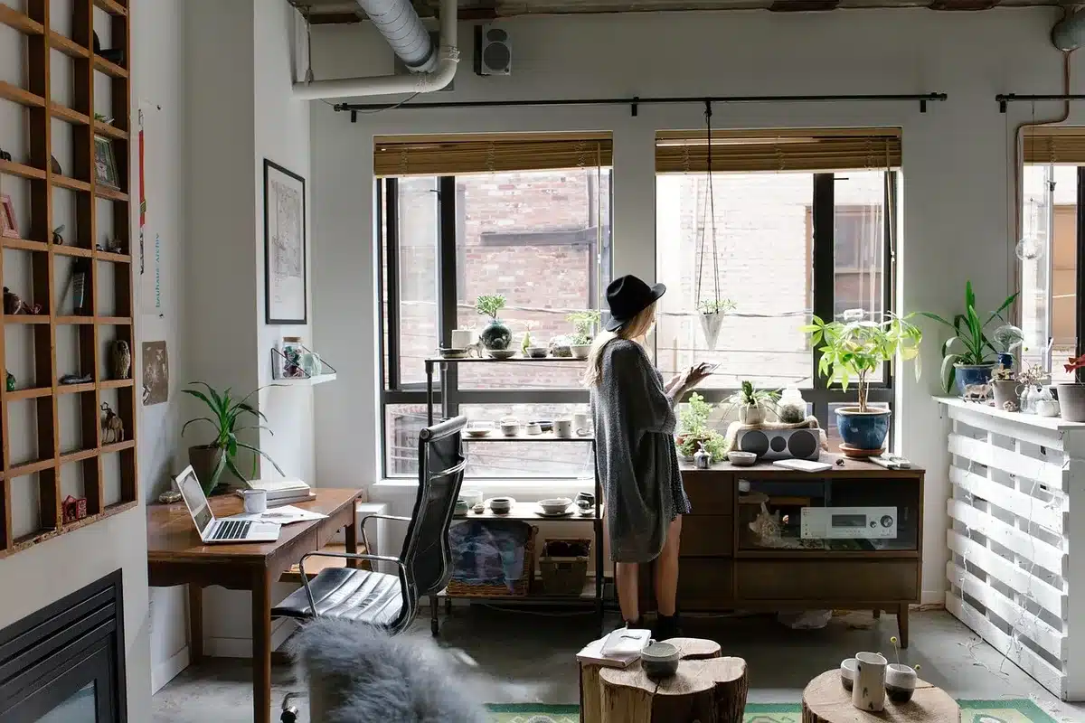 Writers' room with script pages and monitors, symbolizing adaptation development