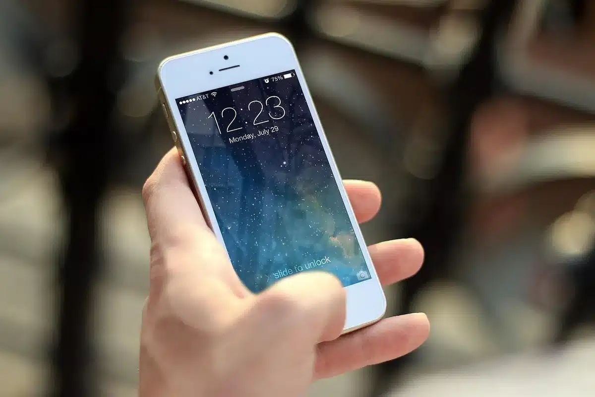 Hand holding smartphone showing a streaming app subscription page