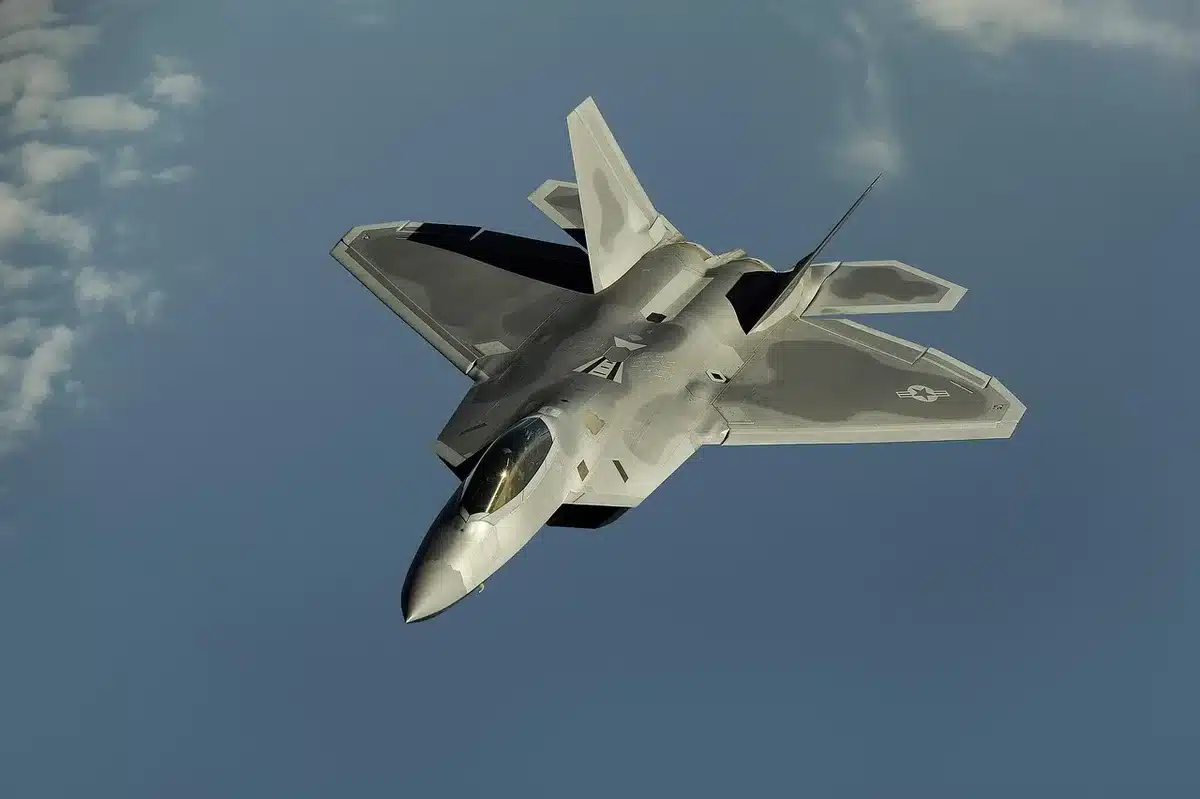 Pilot at a cockpit flight computer entering approach settings