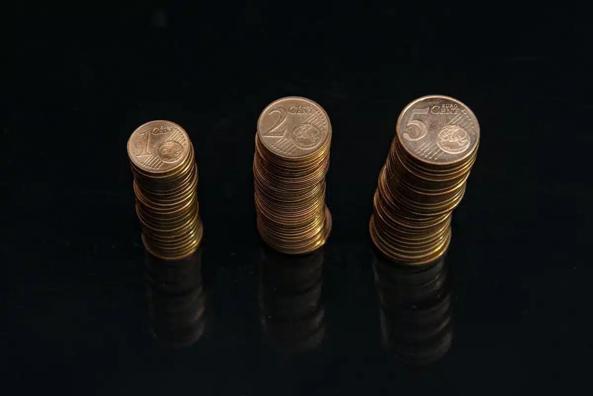 Close-up of silver Roman coins stacked together in a tray