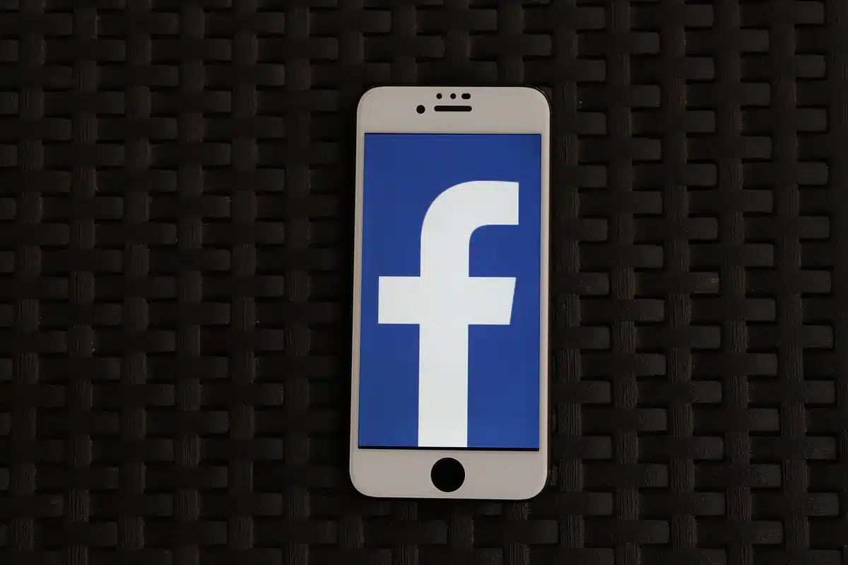 Smartphone screen showing a blurred social media video about celebrity blind items
