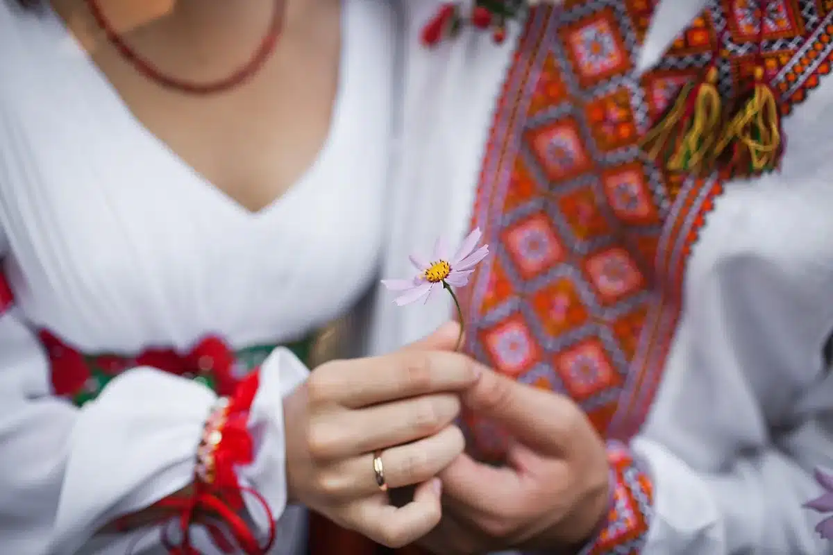 Close-up of a woman's left hand wearing a large diamond ring in Italy