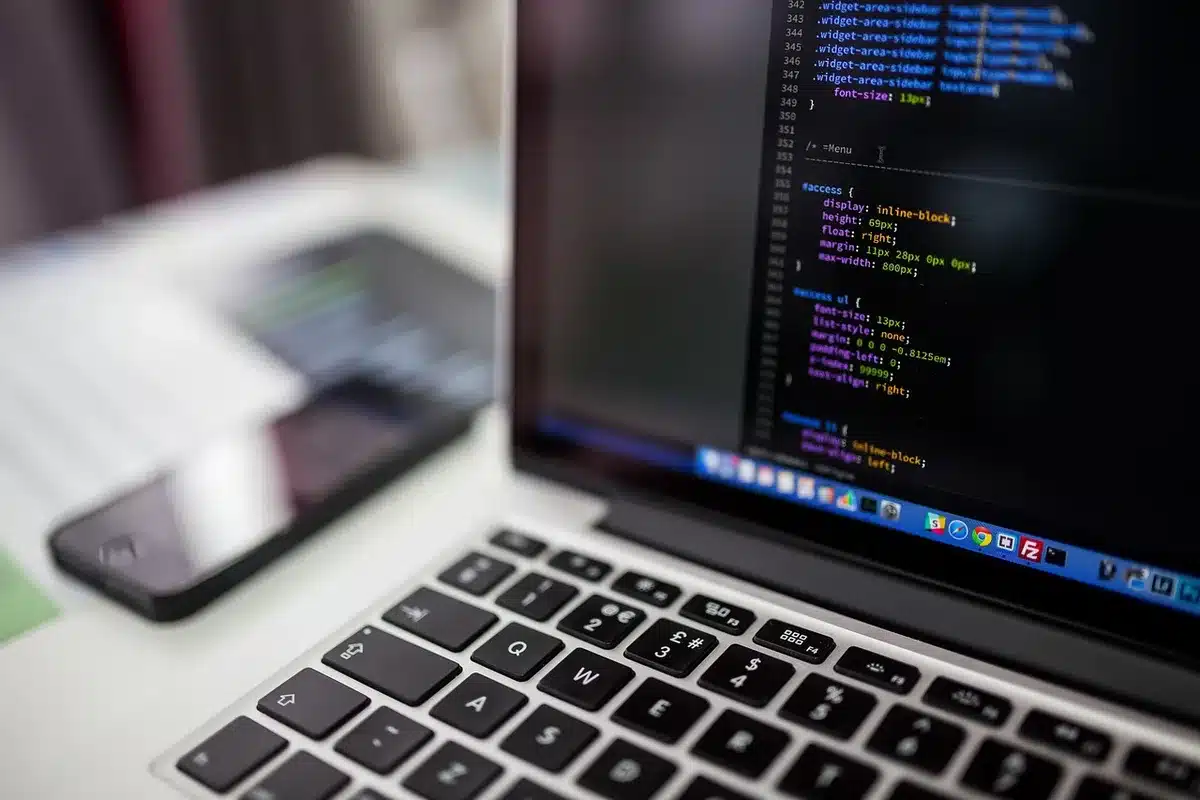 Developer reviewing compatibility checklist on a laptop