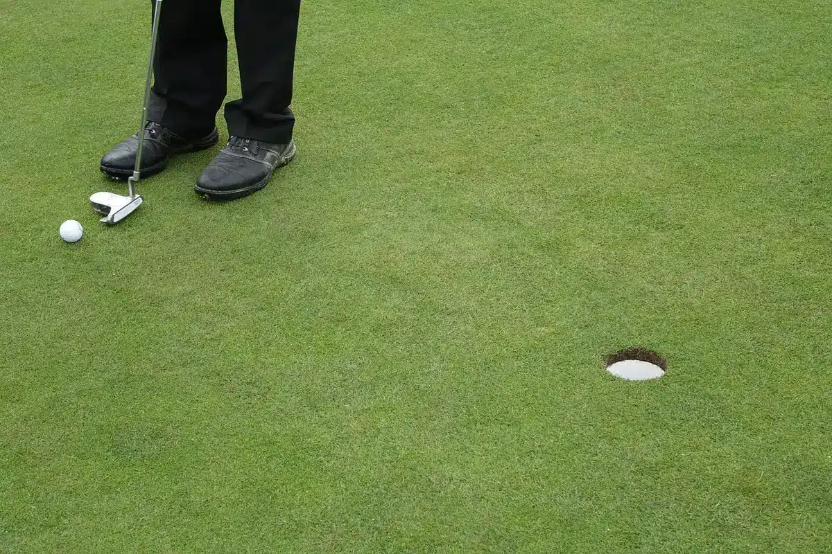 U.S. captain speaking to players near the practice green