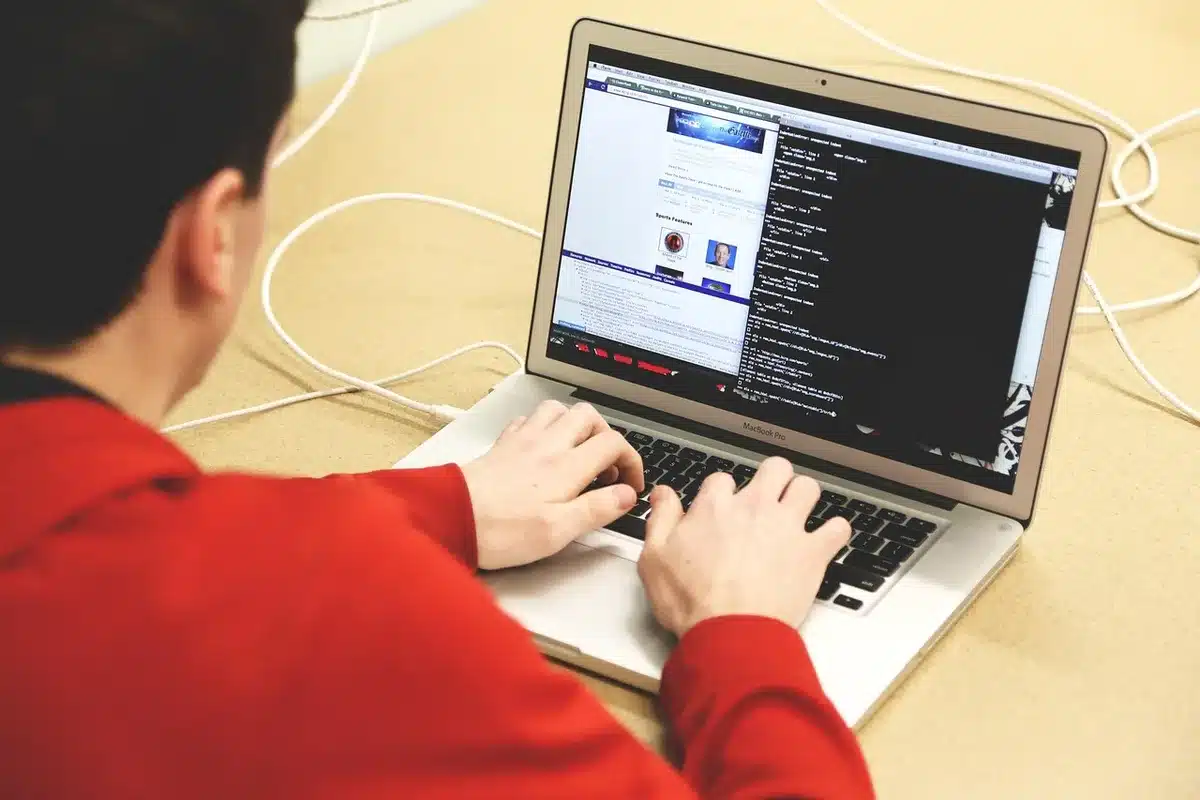 Close-up of code on a laptop screen suggesting automated scripts
