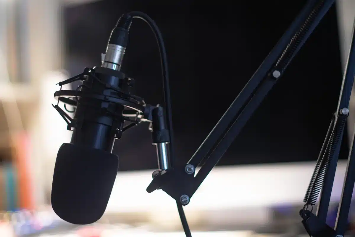 Silhouette of a TV host in a bright studio making an announcement