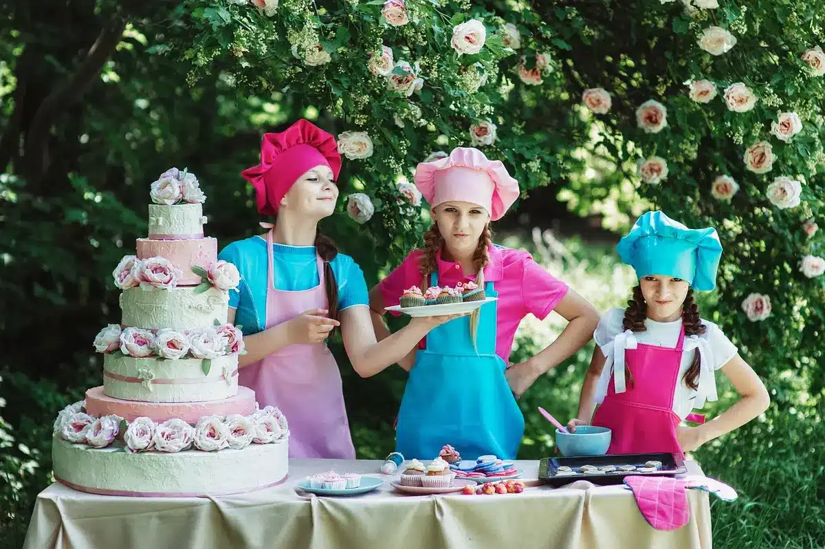 Home bakers arranging pies and cookies on a table during a contest