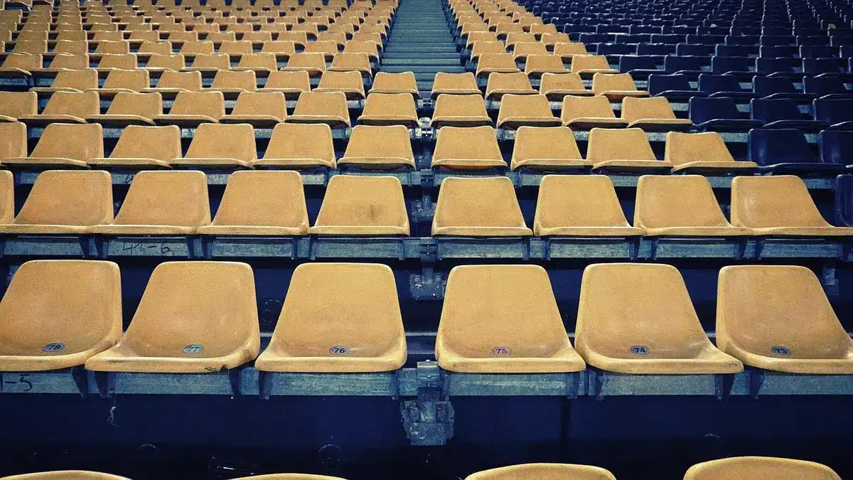 Empty substitutes bench at a stadium representing omission from squad lists
