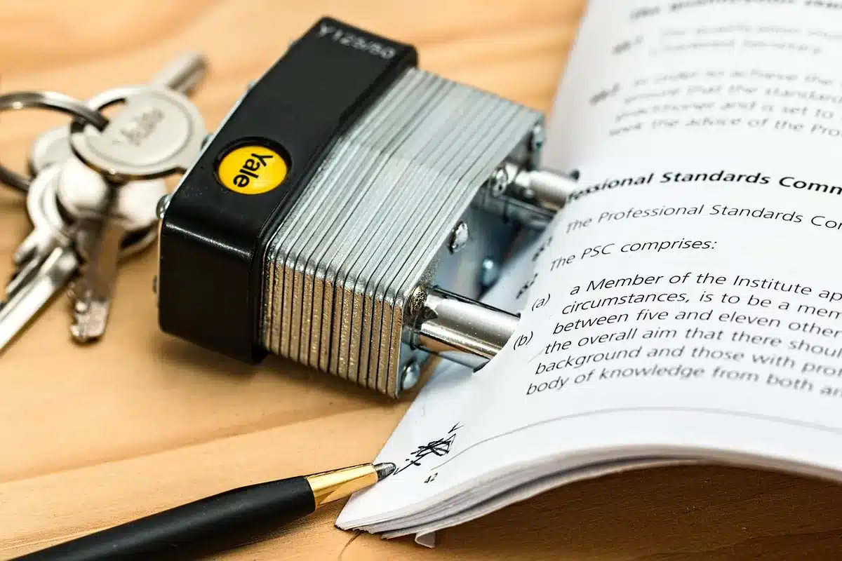 Hands and papers on a negotiation table representing contract talks