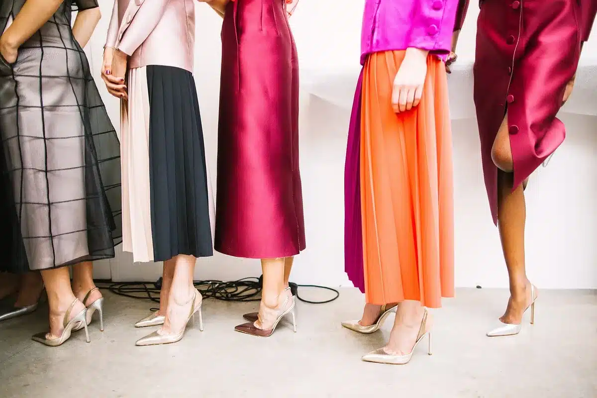 Backstage runway scene with fashion models preparing